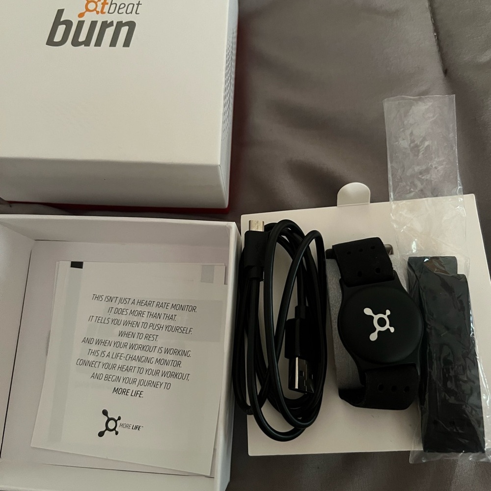 Orange Theory armband heart rate monitor. Used for two classes.